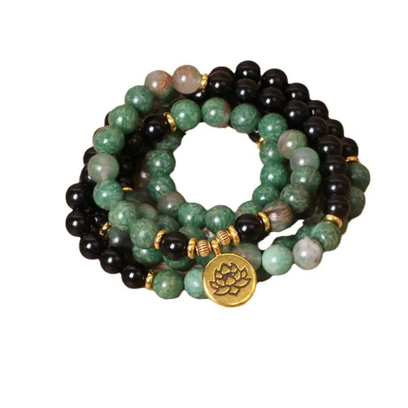 Green and black elastic beaded long bracelet with alloy construction