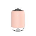 Mini cylindrical USB humidifier with night light in turquoise green, showing water tank and mist outlet