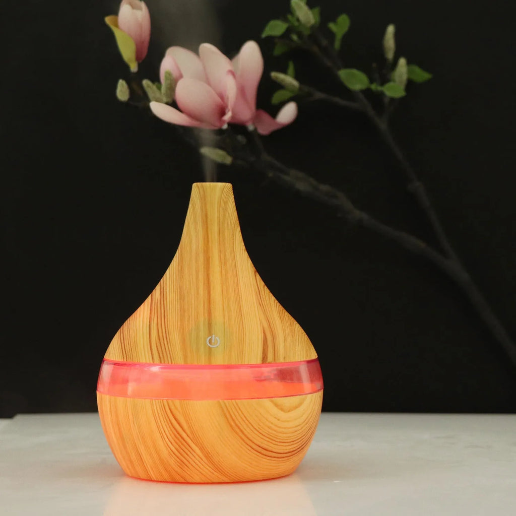 Columnar USB mini air purifier and humidifier in wood grain finish on a desk