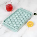 Blue silicone ice cube tray with lid showing 33 round grids, measuring 24x14x3cm