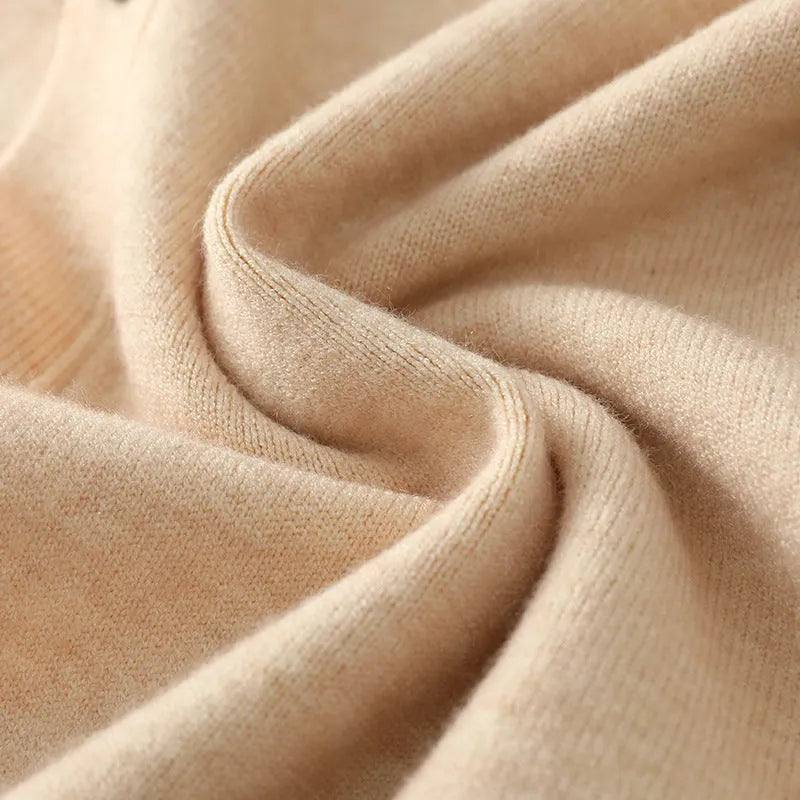 Man wearing beige Andy velvet v-neck cardigan coat with loose fit and long sleeves