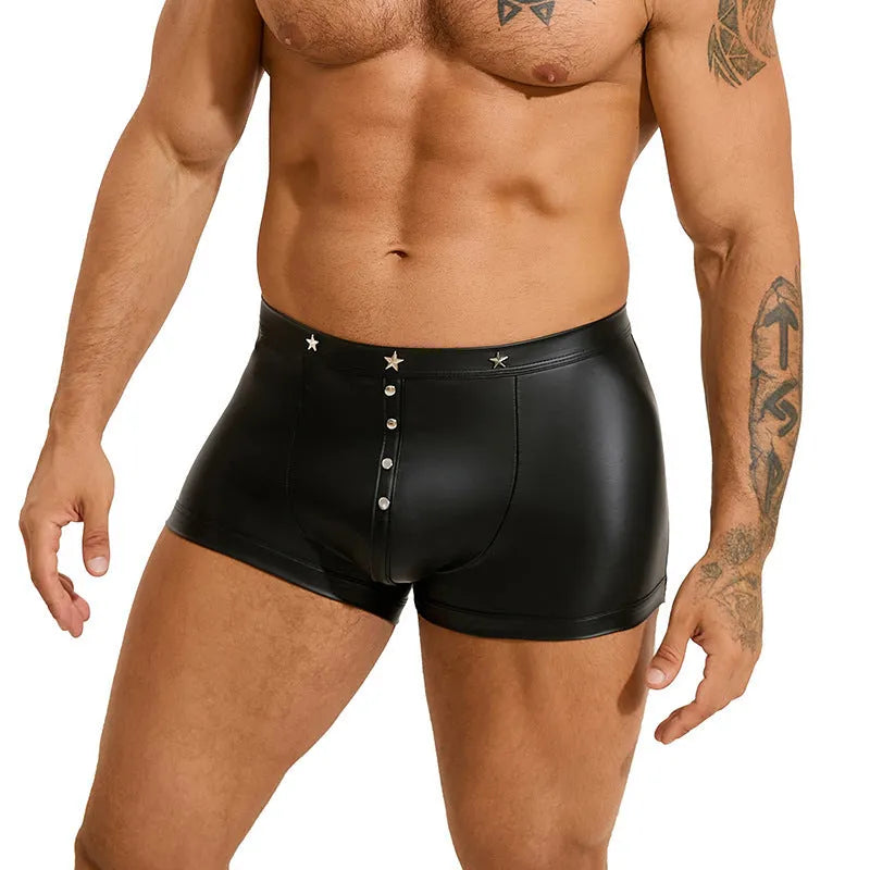 Men's black PU leather boxer shorts with U pouch design laid flat, showing sleek material and construction.