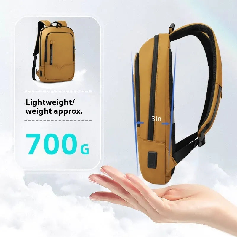 Lightweight solid-colour polyester laptop backpack showing external USB charging port.