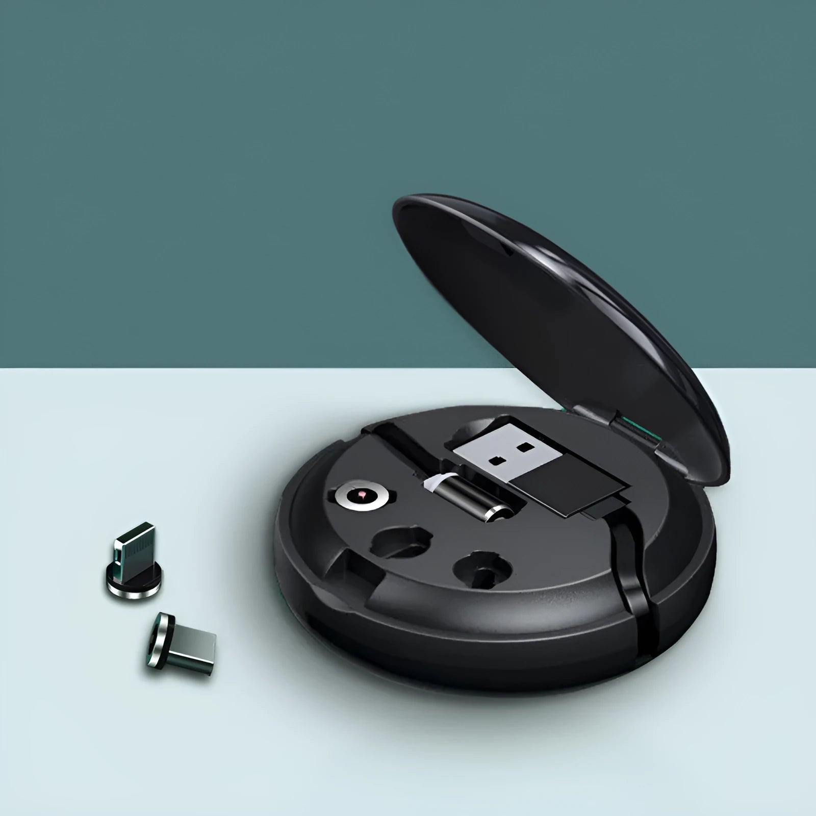 Magnetic Sucker 3-in-1 data cable in black with three connectors on a desk