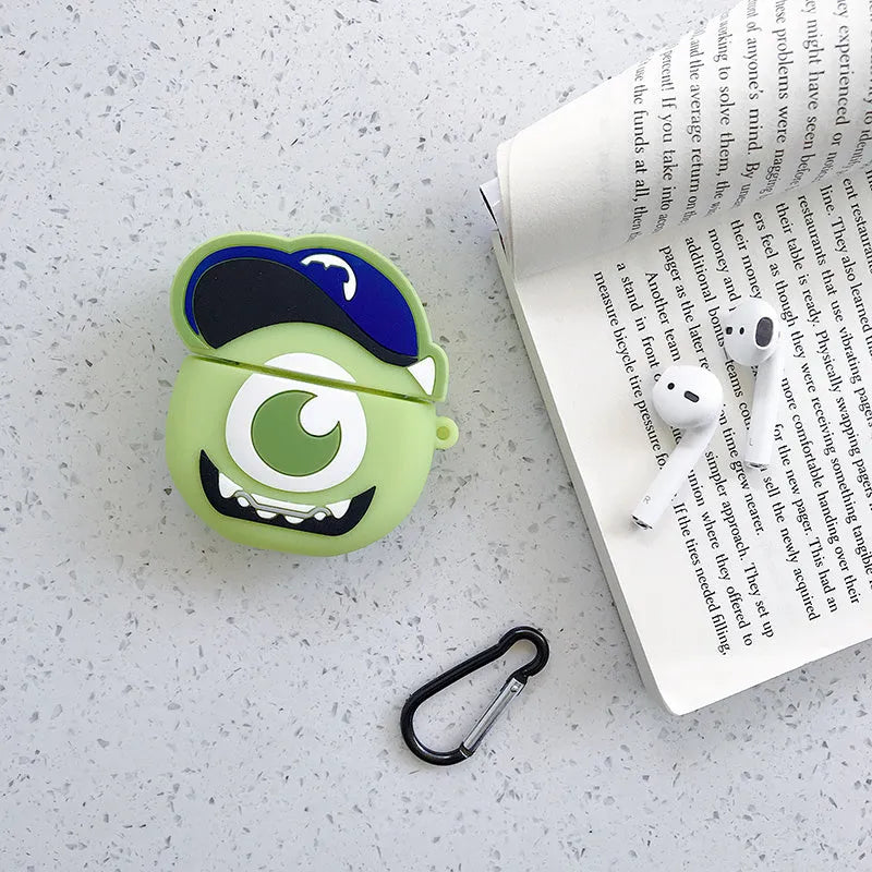 Green silicone AirPods 1/2 generation case with a cartoon animal design on a table.