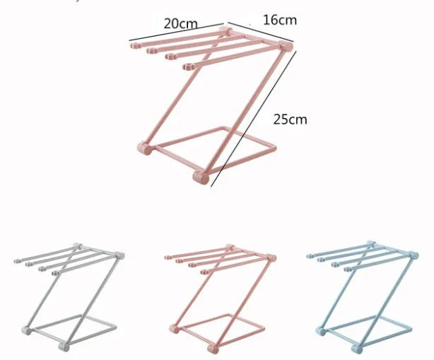 Foldable light grey plastic dishcloth shelf with vertical design mounted on a wall