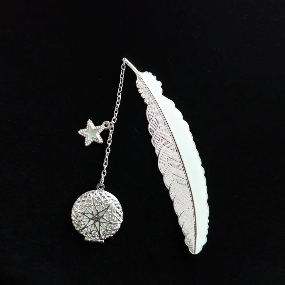 Luminous retro pure copper feather metal bookmark with glow-in-the-dark design showing silver feather and celestial accents