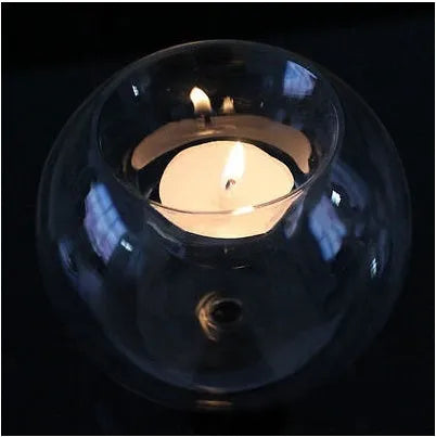 Clear handmade hollow glass spherical candle holder in European style.