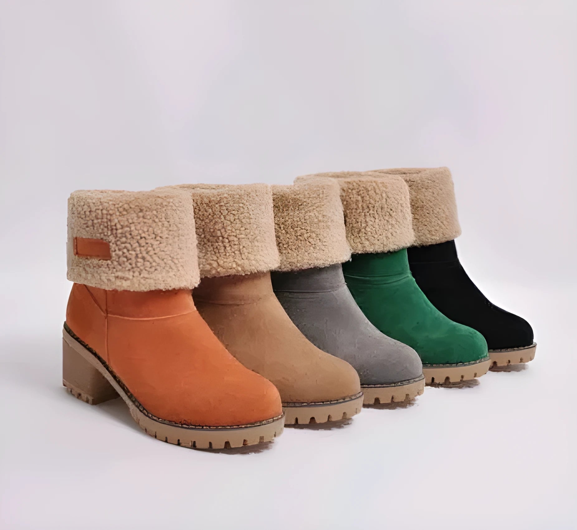 Women's black suede mid-tube snow boots with a thick heel and round toe on a waterproof platform.