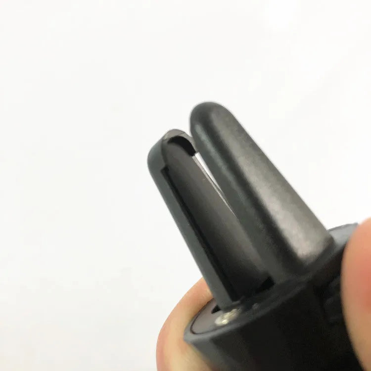 Black universal car phone holder attached to a car air vent, showing flexible gooseneck arm and adjustable phone cradle.
