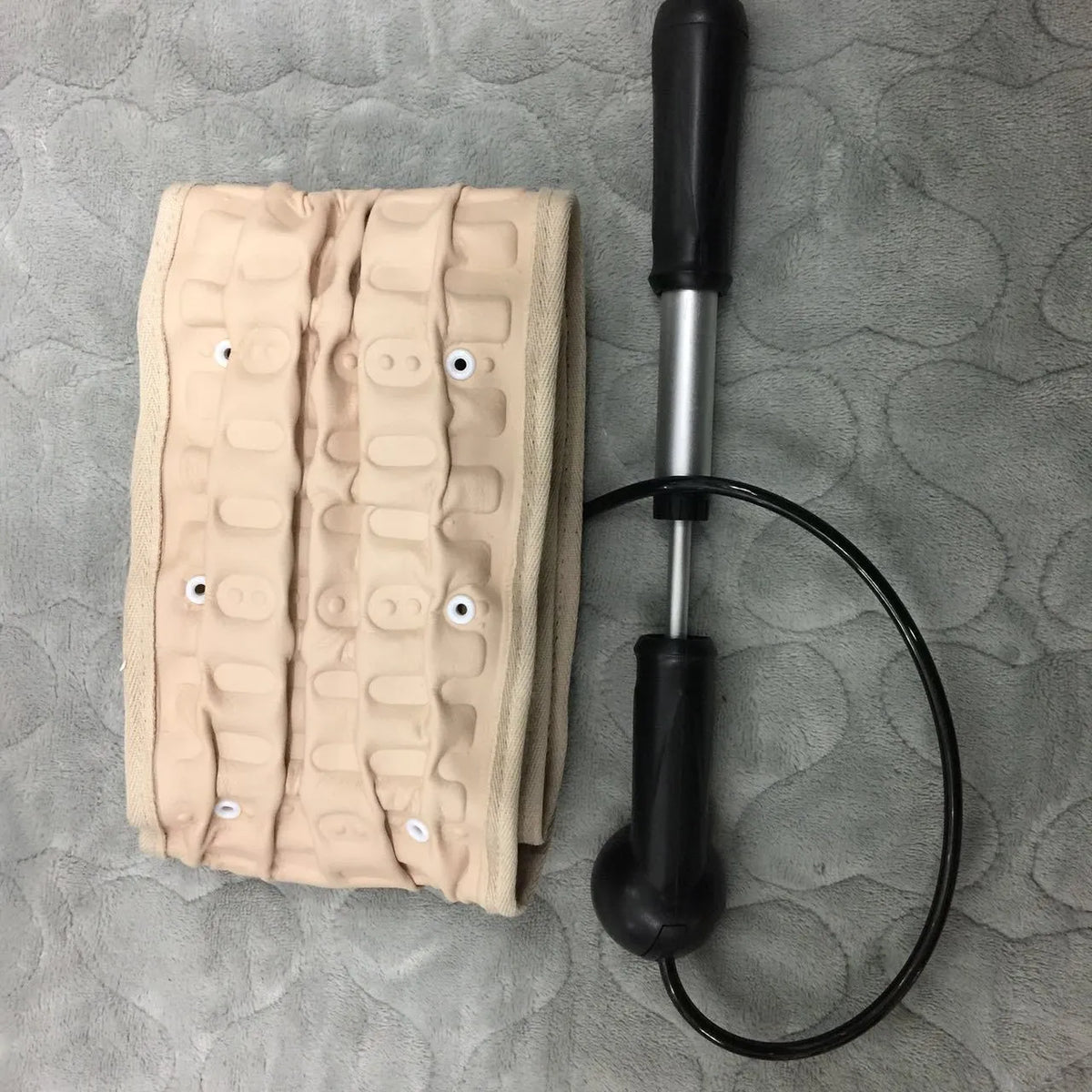 Waist air traction brace belt with inflatable ball and magnetic massage for lumbar spine support, worn on the waist
