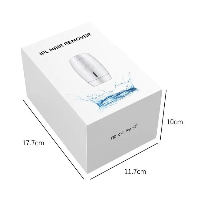White home laser hair removal instrument with display, shown next to its power adapter and box.