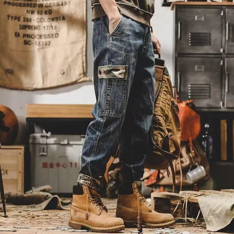 Men's loose blue denim cargo jeans with heavy distressed finish, mid waist, button fly