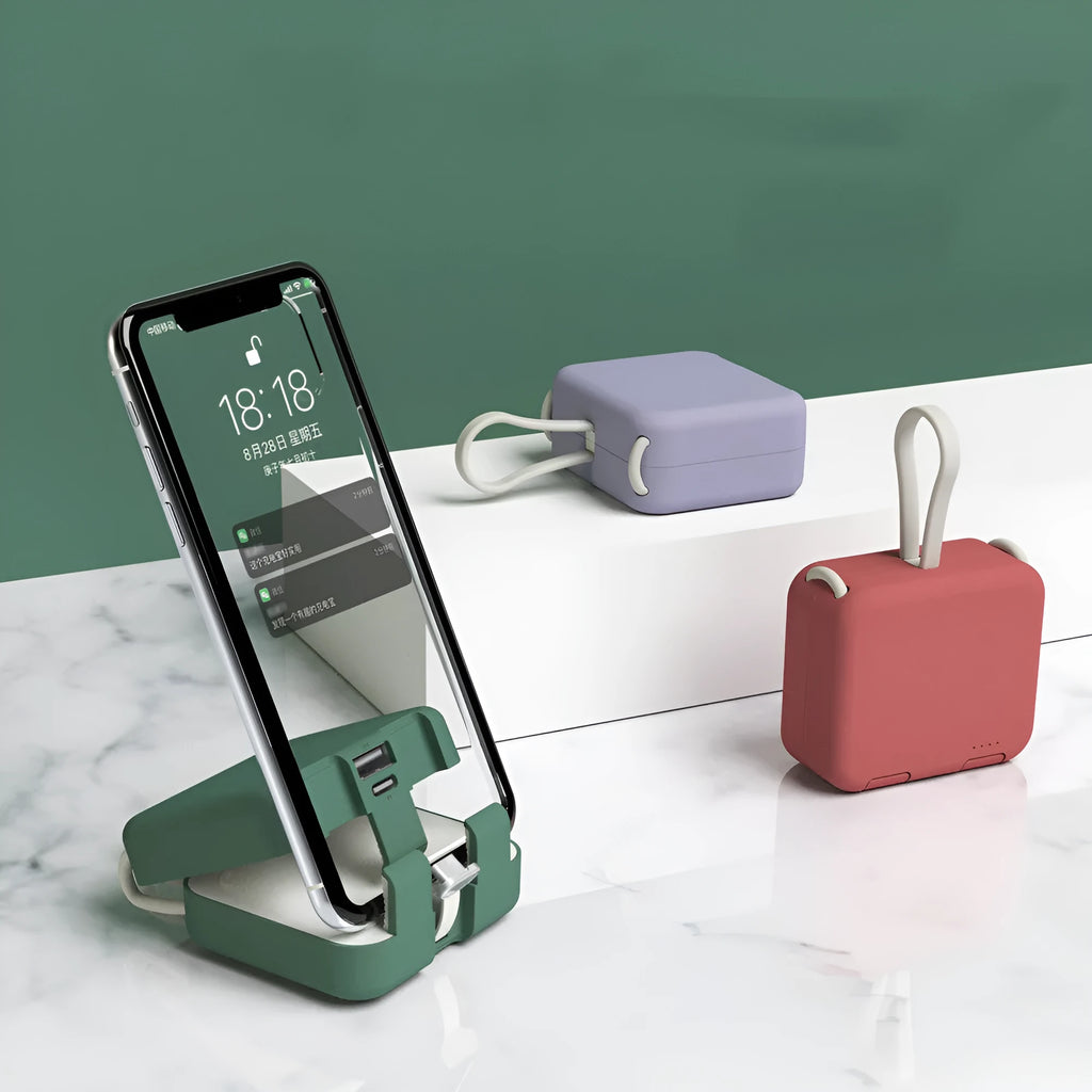 Handbag clip power bank in blue, green, red, or white with mobile phone stand functionality and dual charging ports