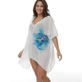 White plus-size loose beach cover-up blouse for women on a hanger.