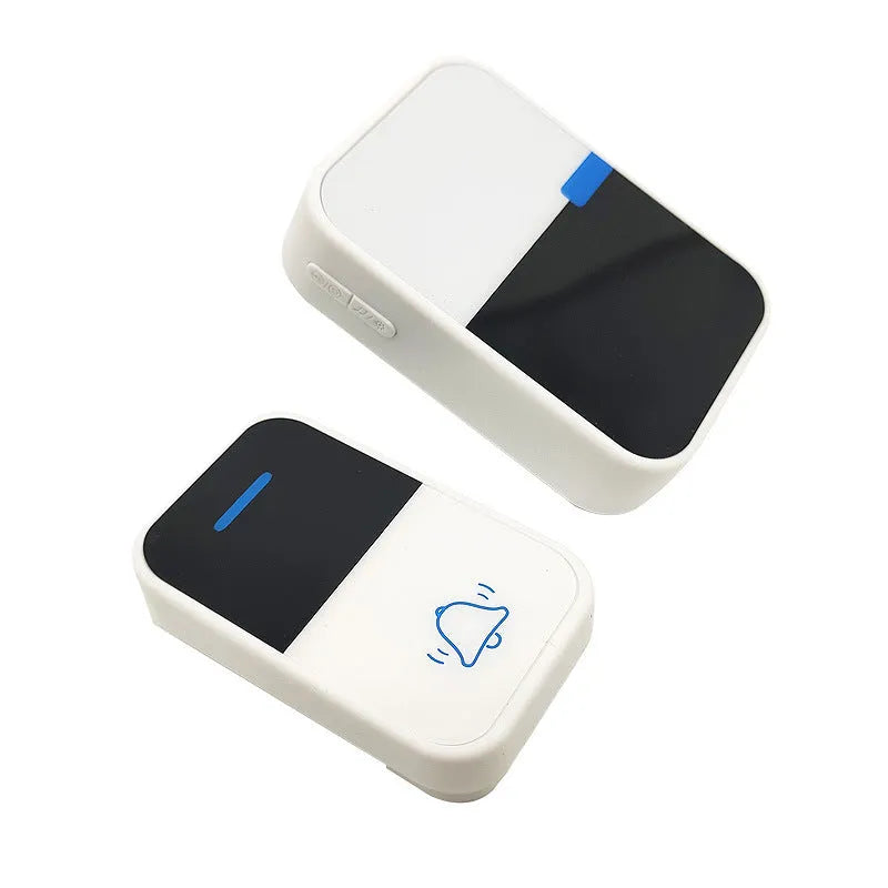 White wireless doorbell kit with plug-in chime and push button on a wooden table