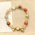 Gold citrine crystal bracelet with hand-woven auspicious symbols including Ruyi, Totem and Fu character patterns