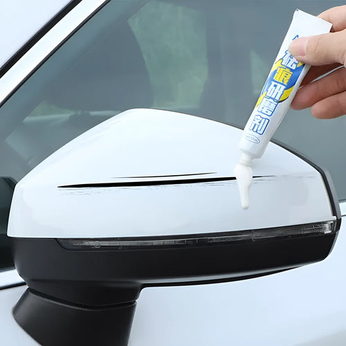Automotive paint repair pen kit with touch-up paint, wax, sponge, and sandpaper for car scratches
