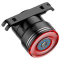 Black aluminium alloy smart bicycle tail light showing USB port and brake-sensing sensor.