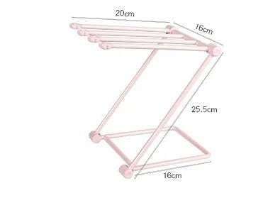 Foldable light grey plastic dishcloth shelf with vertical design mounted on a wall