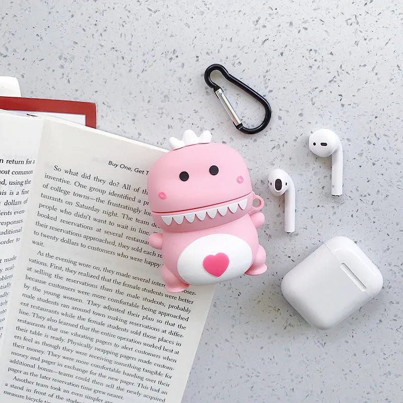 Green silicone AirPods 1/2 generation case with a cartoon animal design on a table.