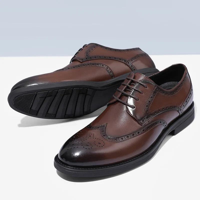 Men's black brogue formal shoes with a lace-up front and perforated detail.