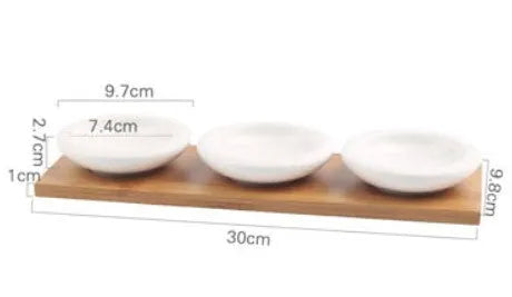 Porcelain ceramic dried fruit dish with compartments on wooden serving board