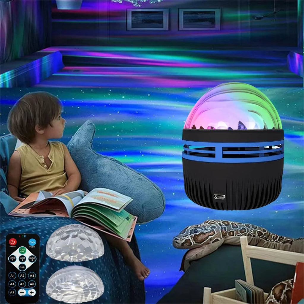 Compact white LED star projector lamp on a table, projecting galaxy light patterns on a dark wall.