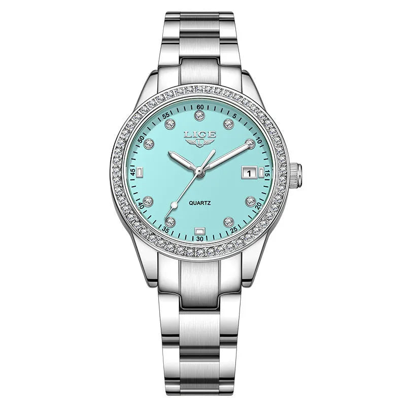 Women's silver stainless steel quartz watch with diamond dial and luminous hands on wrist.