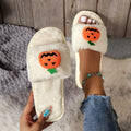 Halloween pumpkin plush slippers with cartoon design on synthetic fur upper, open toe style