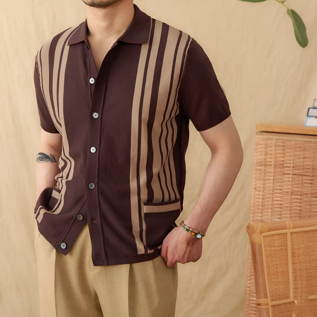 A royal blue striped short-sleeved polo cardigan with a lapel collar, laid flat.