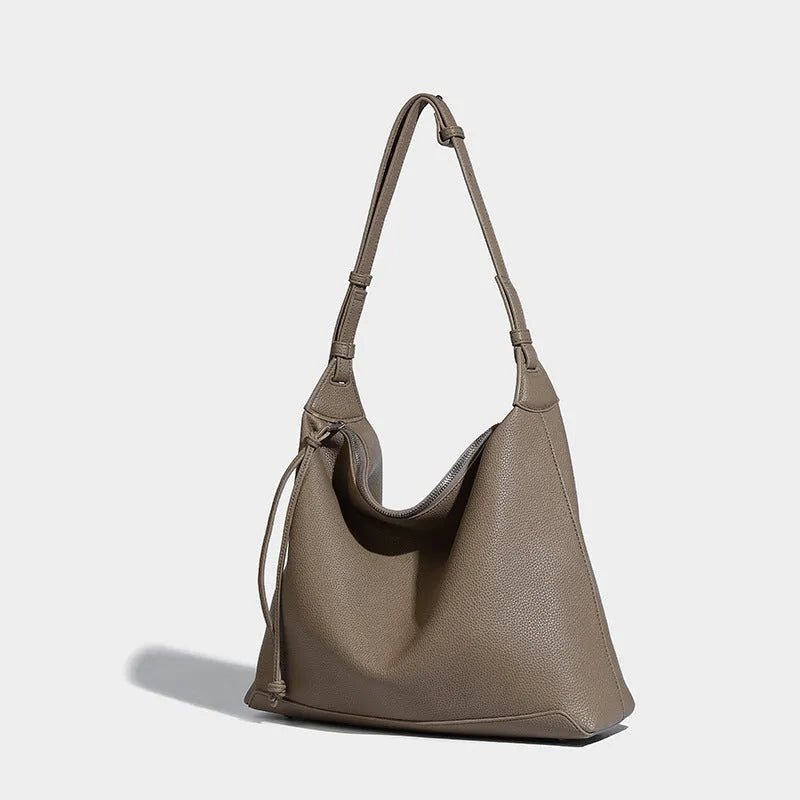 Large capacity caramel coloured underarm shoulder messenger bag made from soft PU material