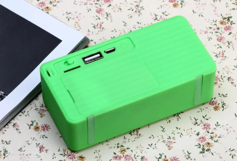 Cannon X3 cube-shaped portable wireless Bluetooth speaker in blue colour with integrated carry handle.