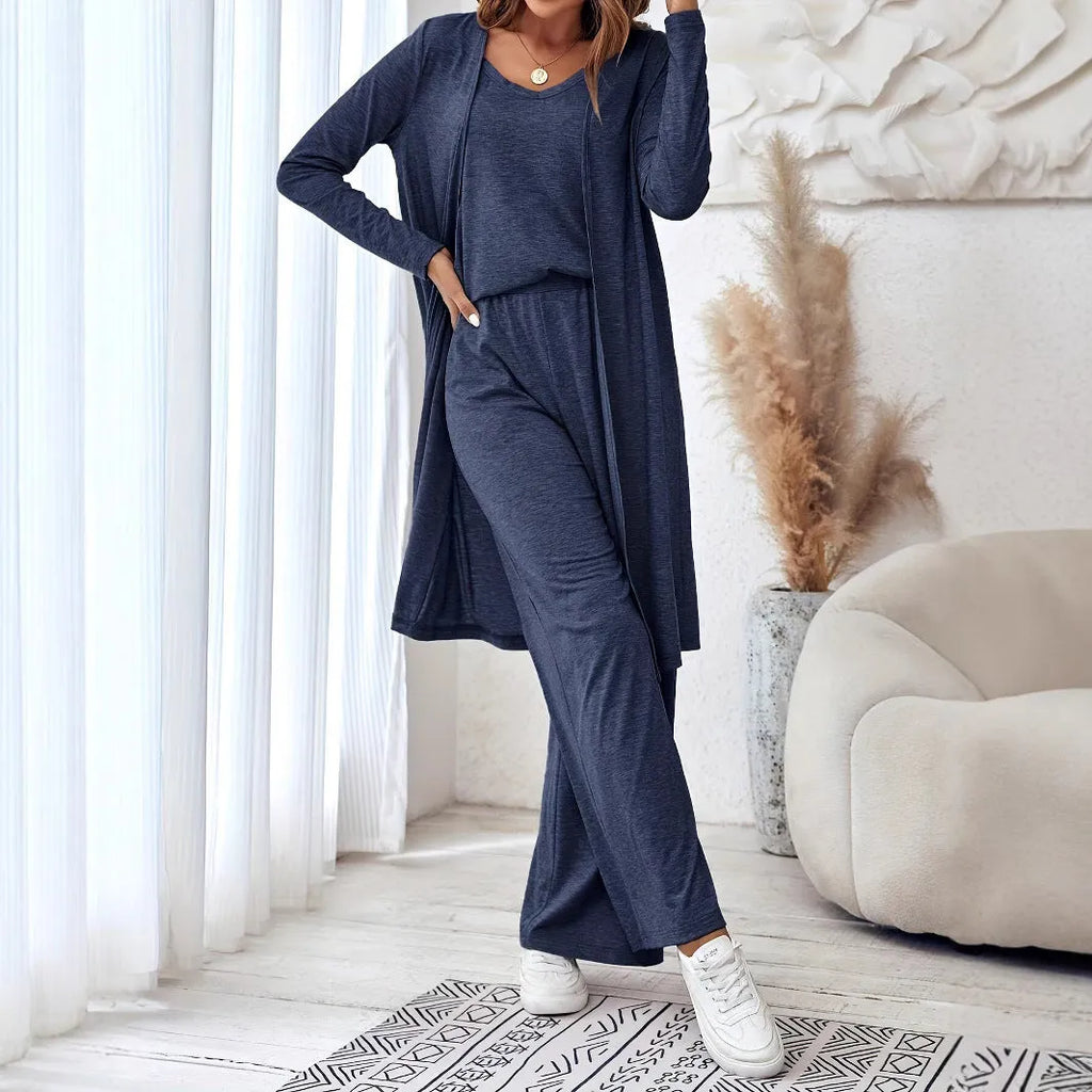 Blue women's casual two-piece suit with top, trousers, and black suspenders laid flat.
