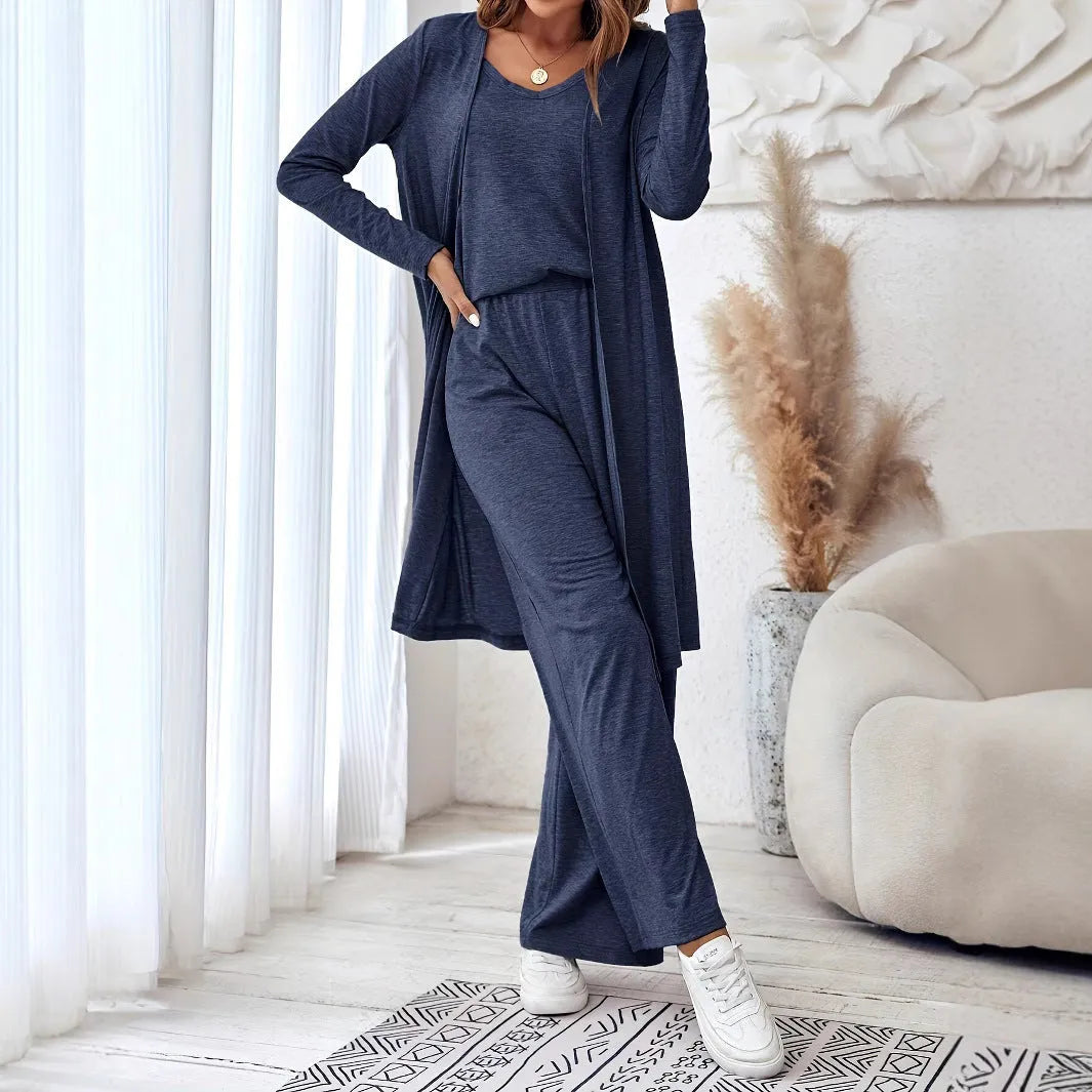 Blue women's casual two-piece suit with top, trousers, and black suspenders laid flat.