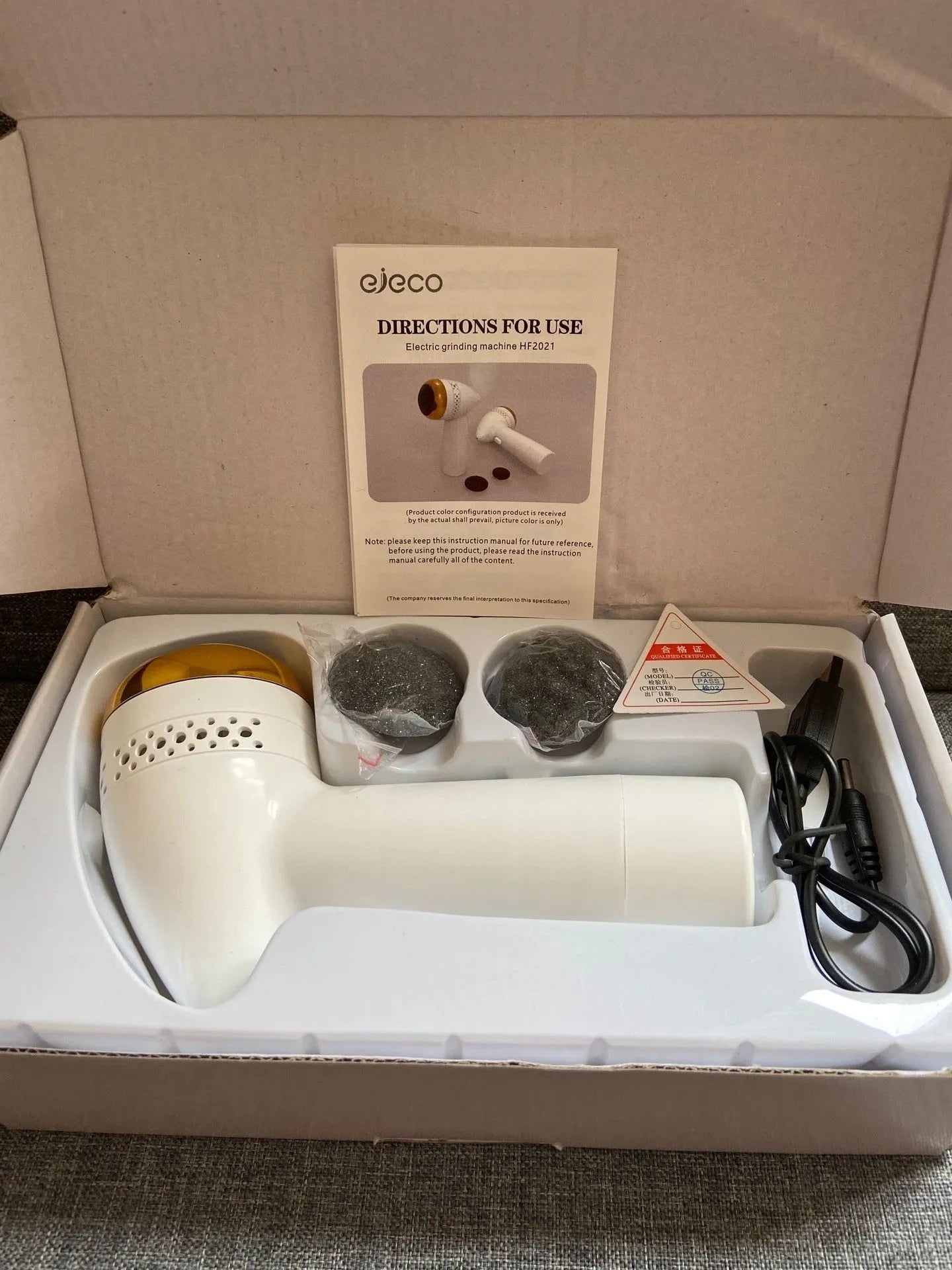 Electric vacuum foot grinder with a refined quartz grinding head in a gold finish.