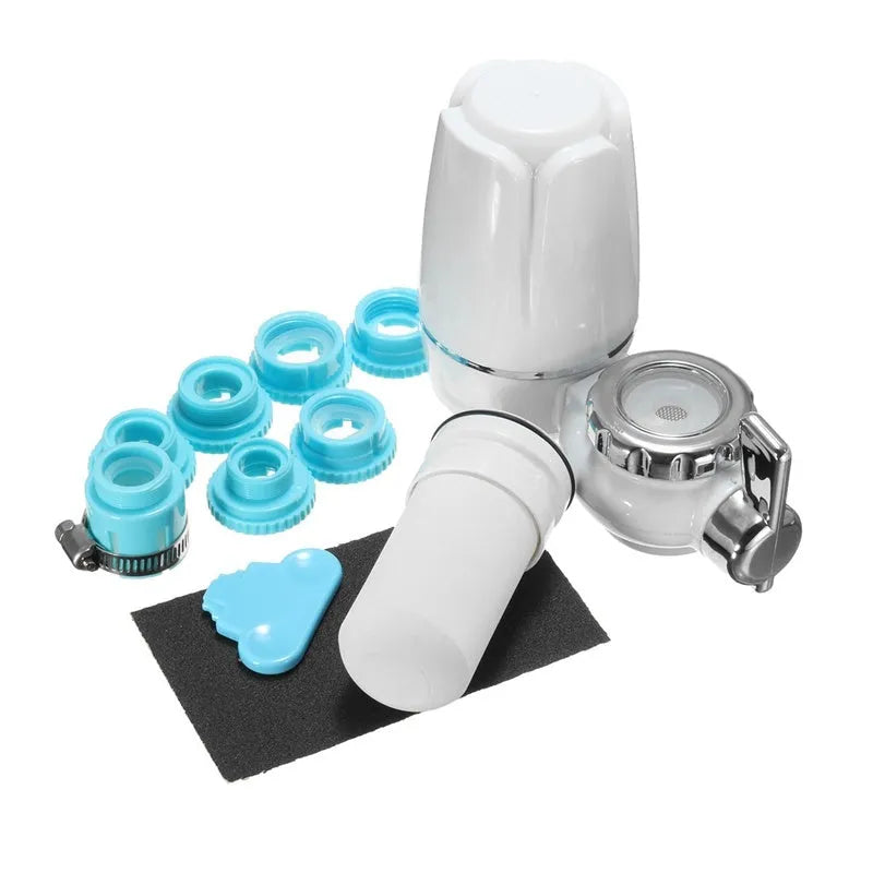 White plastic faucet water filter unit with adapters and ceramic cartridge for kitchen tap installation.