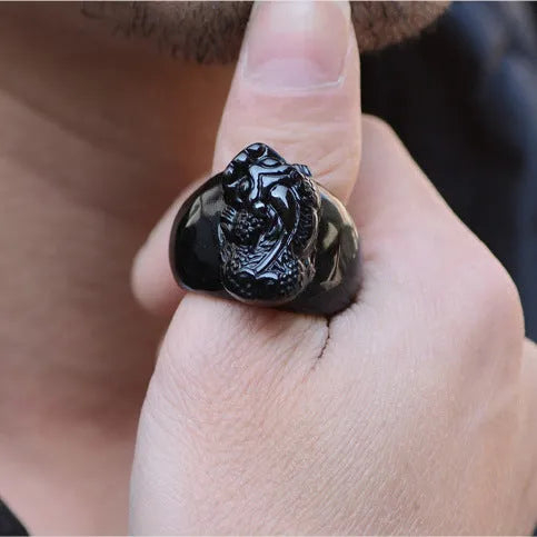 Men's obsidian Pixiu thumb ring showing natural gold sheen crystal on alloy band