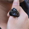 Men's obsidian Pixiu thumb ring showing natural gold sheen crystal on alloy band
