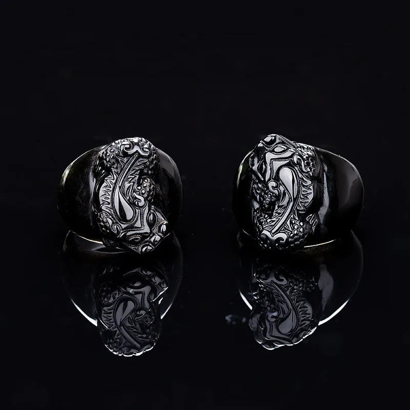 Men's obsidian Pixiu thumb ring showing natural gold sheen crystal on alloy band