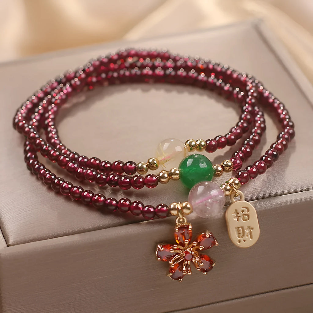 Women's natural crystal bracelet in pomegranate red cherry blossom colour with sequin accents