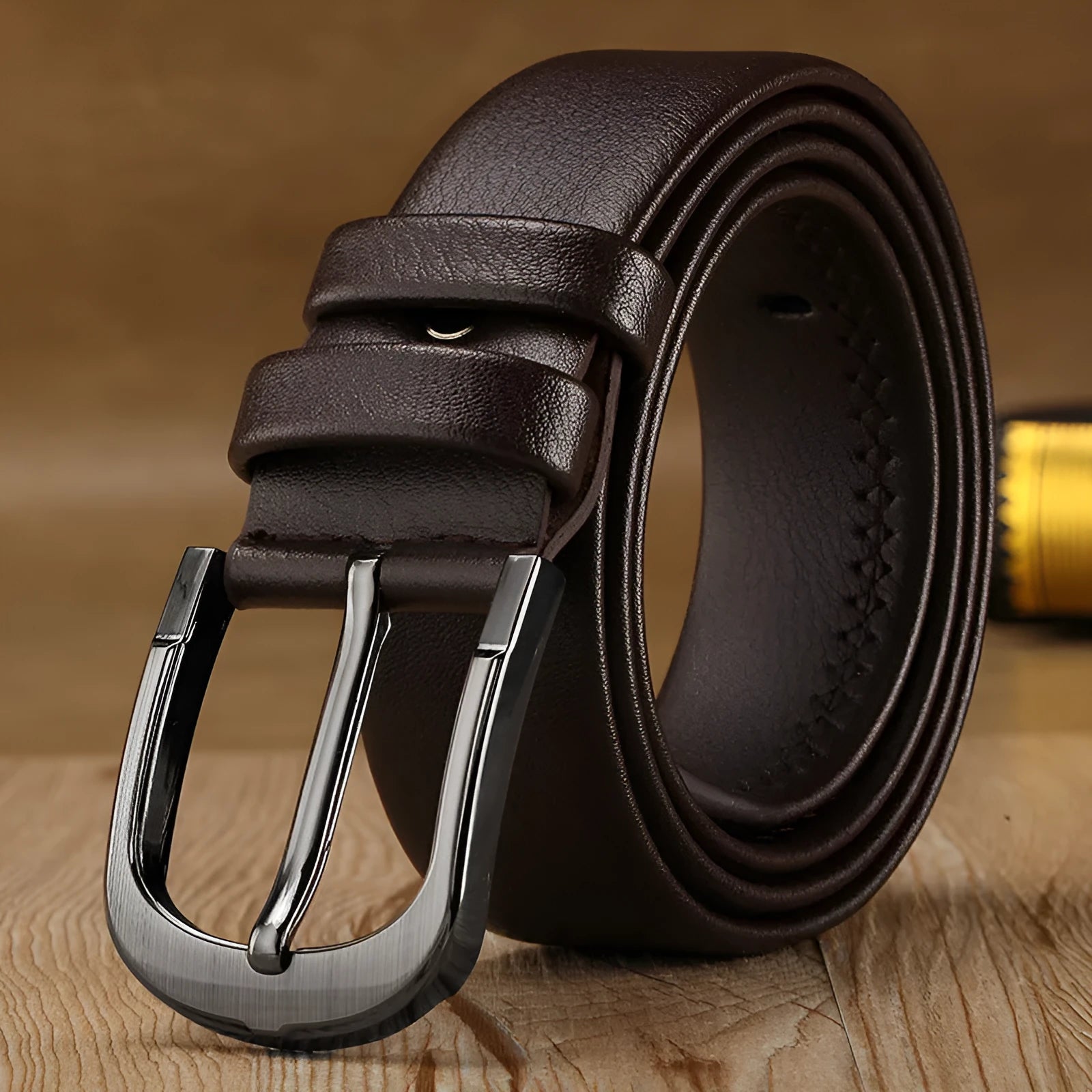Men's pin buckle belt in black with alloy buckle and imported fibre body shown on a neutral background