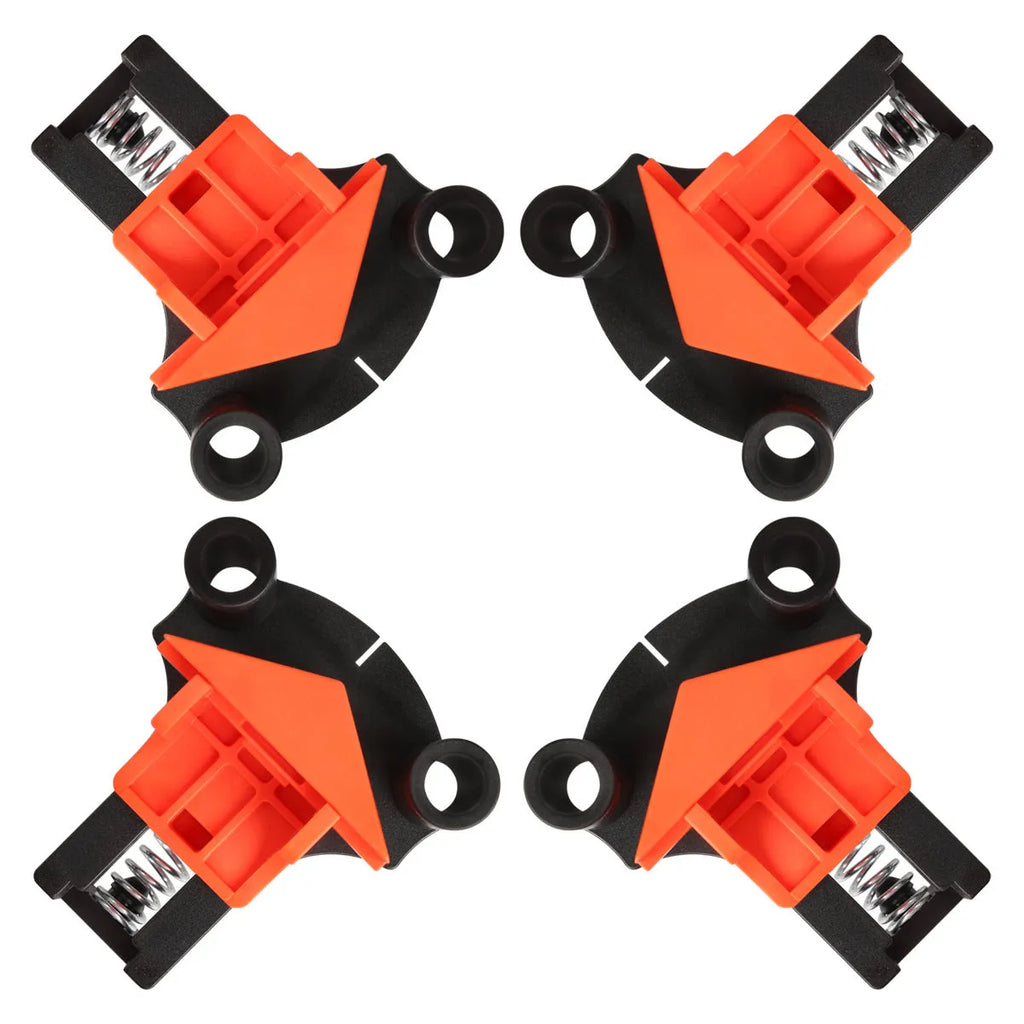 Four plastic 90-degree right angle wood clamps for frame and box assembly.