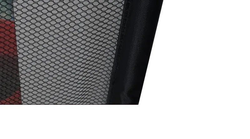 Black foldable cloth pet fence for dogs, placed indoors near doorway