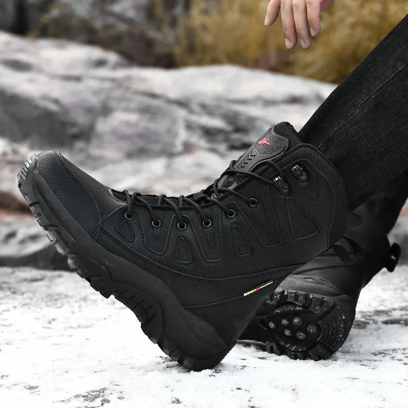 Men's cowhide leather hi-top hiking shoes in beige colour on a rocky outdoor path.