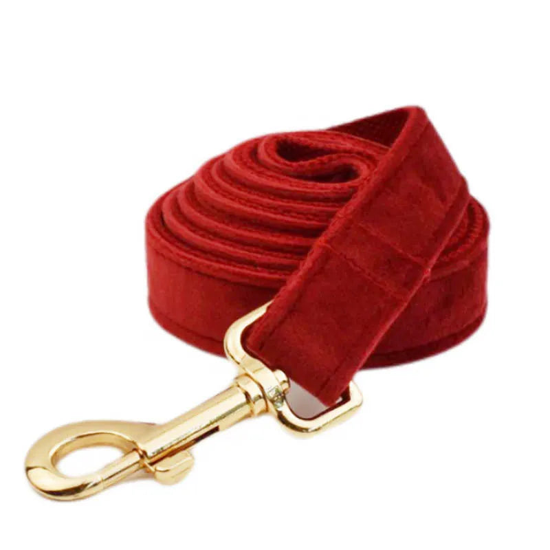 Soft cloth dog collar and leash set with matching vest, red bow tie, and included poop bag on a white background.
