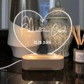 Custom transparent acrylic LED night light personalised with names and date, 20cm by 11.5cm.