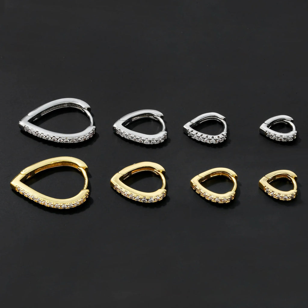 Geometrical heart-shaped gold and white gold electroplated copper ear clip for women.