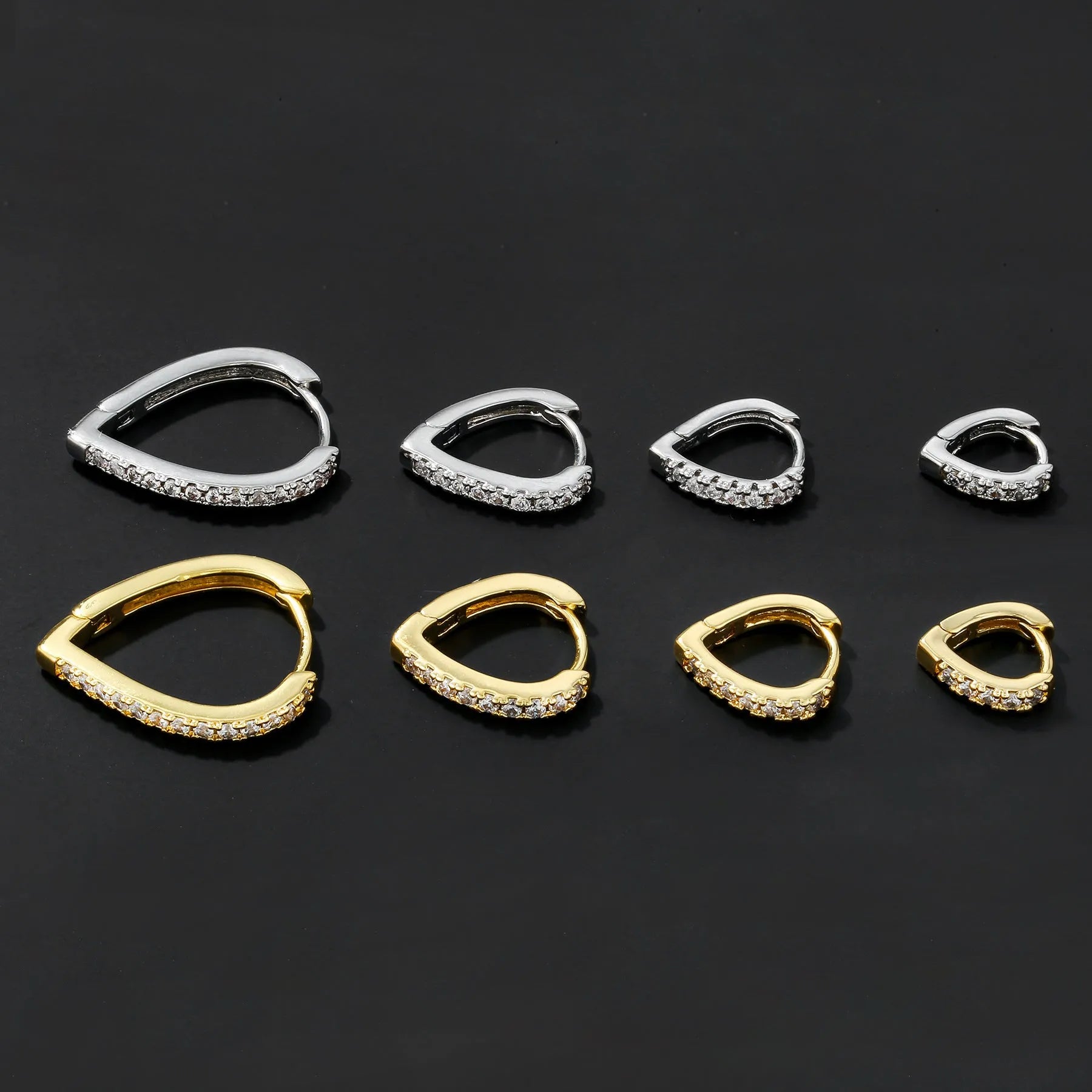 Geometrical heart-shaped gold and white gold electroplated copper ear clip for women.