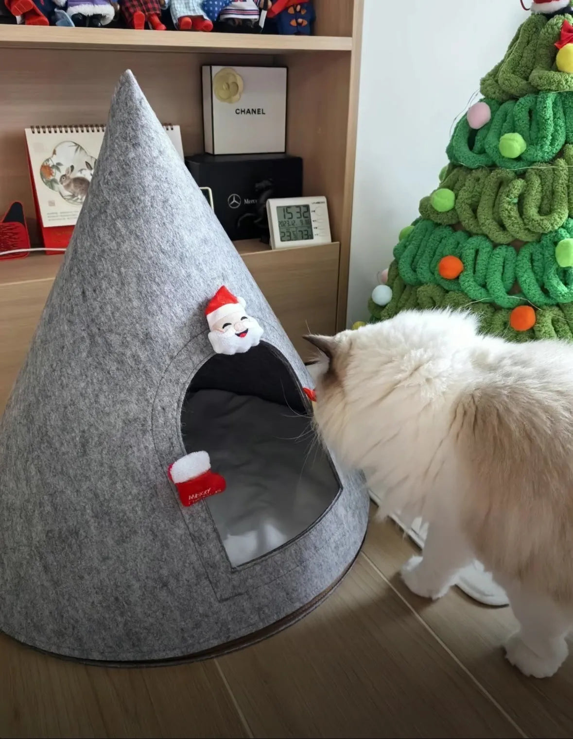 Grey handmade felt cone-shaped cat house with Christmas theme, showing enclosed tent-style design.